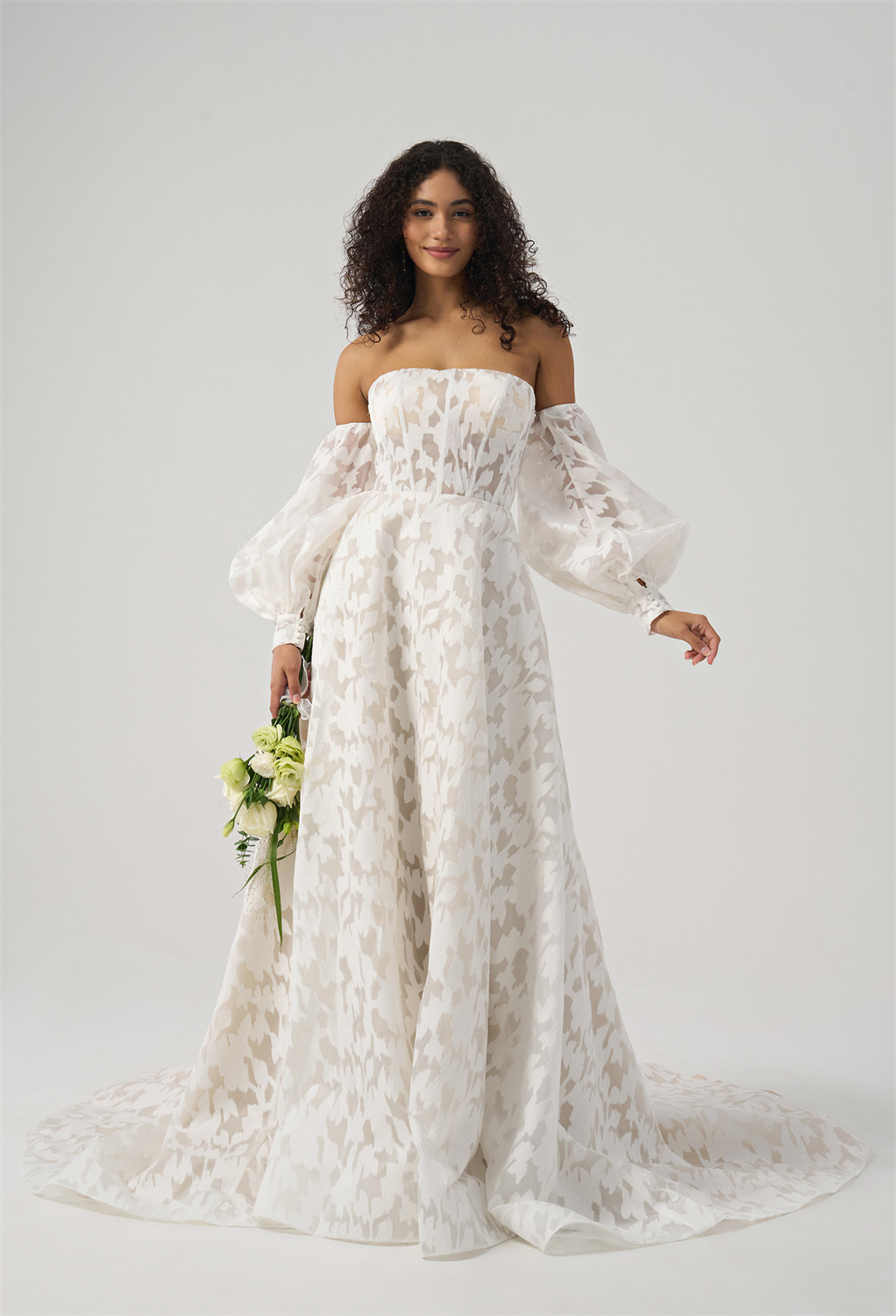 featuring elegant organza in an A-line silhouette. This floor-length gown has a straight neckline