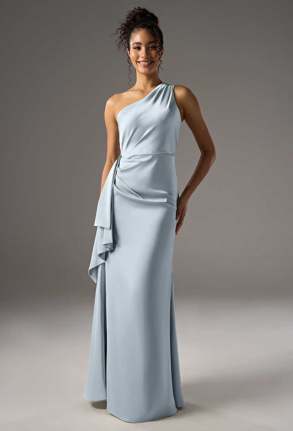 A-line bridesmaid dress. It features a one-shoulder neckline and sleeveless