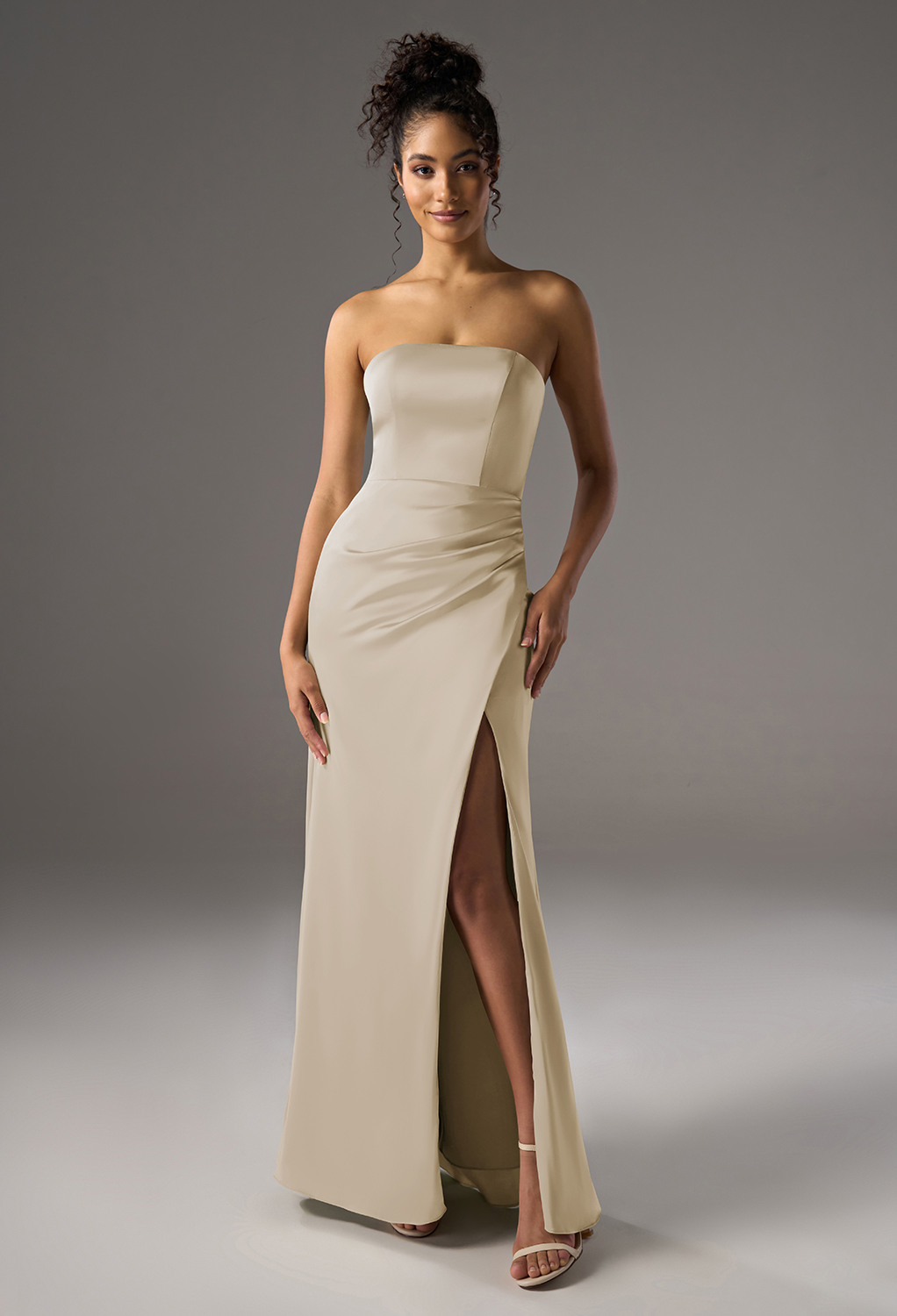 mermaid bridesmaid dress. It features a straight neckline and sleeveless