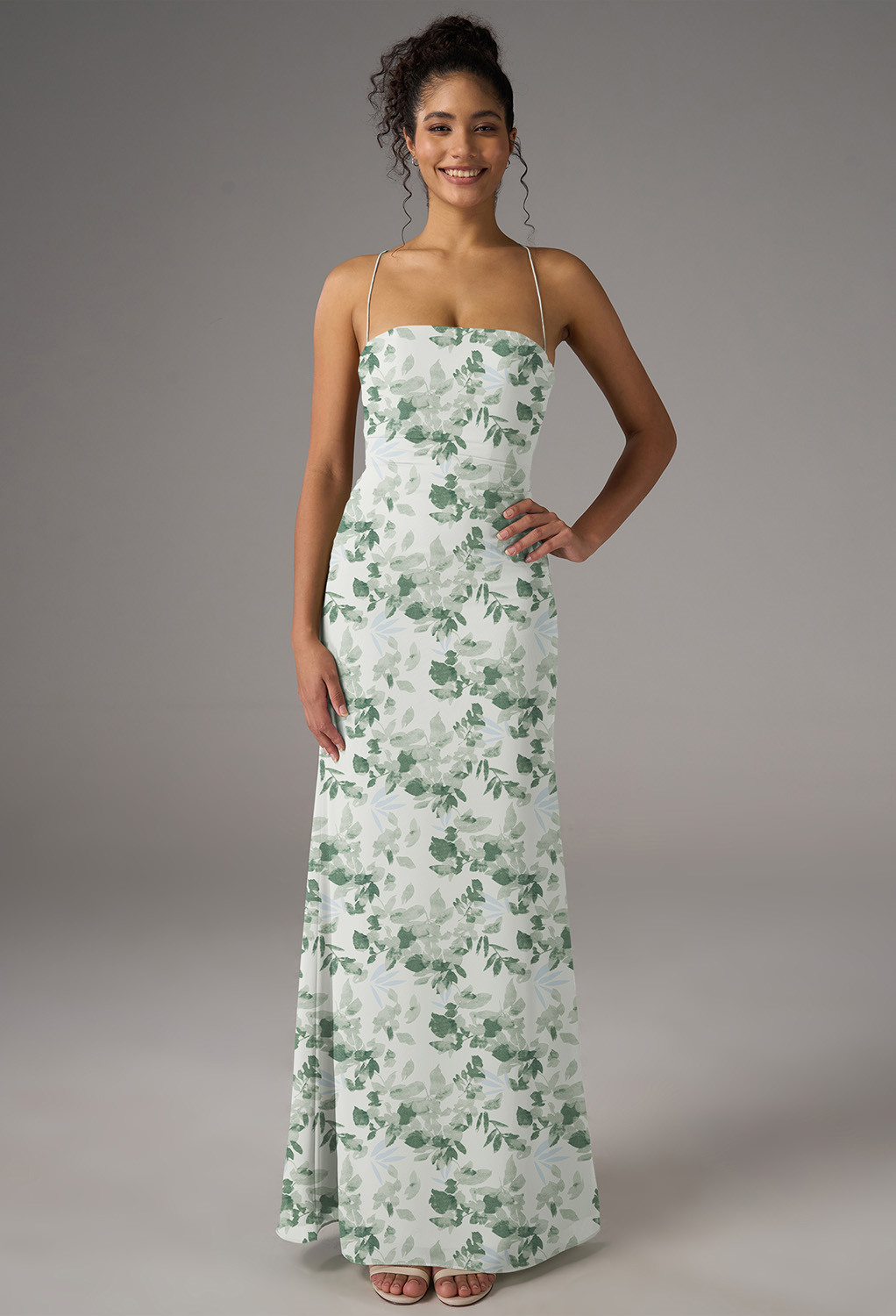 Embrace elegance with the AW Jay Dress. This chiffon A-line gown features a floor-length hem and a straight neckline. The sleeveless design with spaghetti straps makes it perfect for weddings or formal events. Step into sophistication effortlessly.