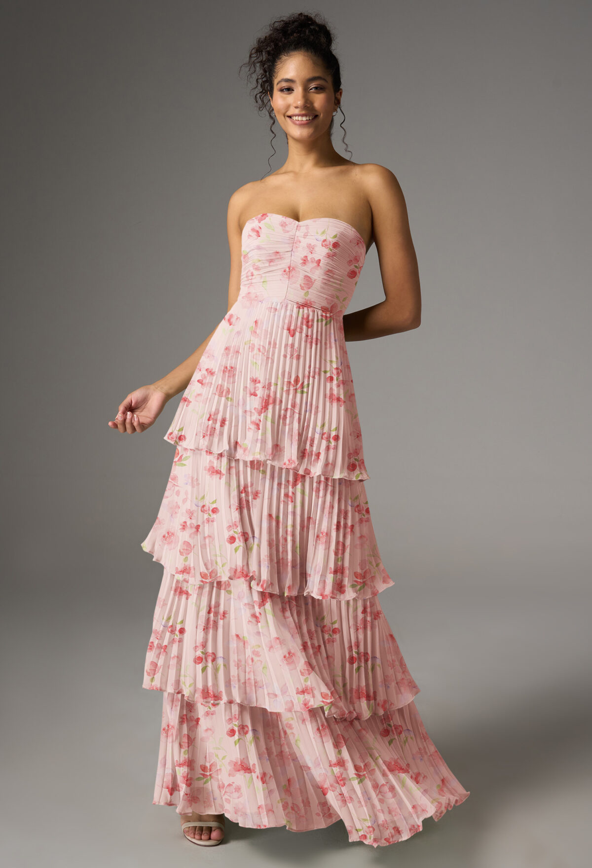 a chiffon A-line gown with a floor-length hem and sweetheart neckline. The sleeveless