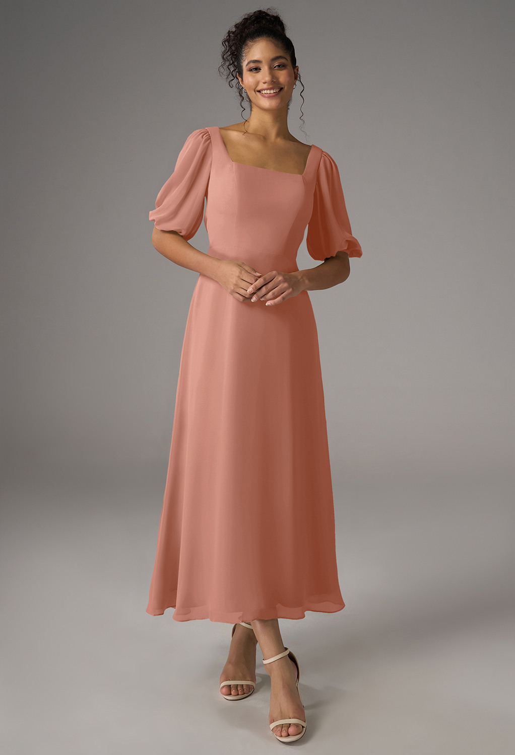 featuring an A-line silhouette in chiffon with an ankle-length hem and square neckline. The strapless design with optional short sleeves is perfect for garden parties or elegant evening events. Embrace graceful sophisticati