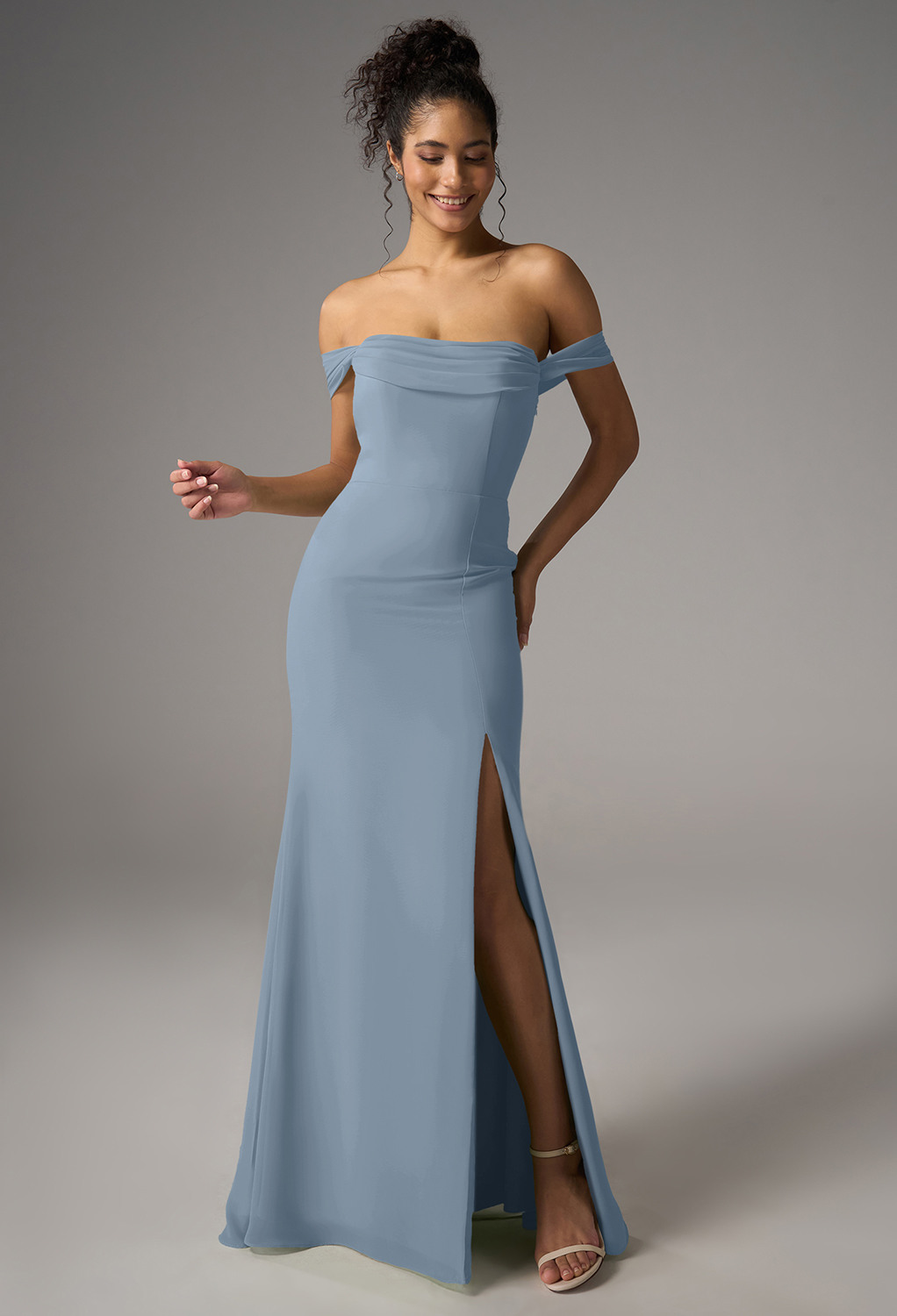 a chiffon mermaid silhouette with a floor-length hem and straight neckline. The strapless