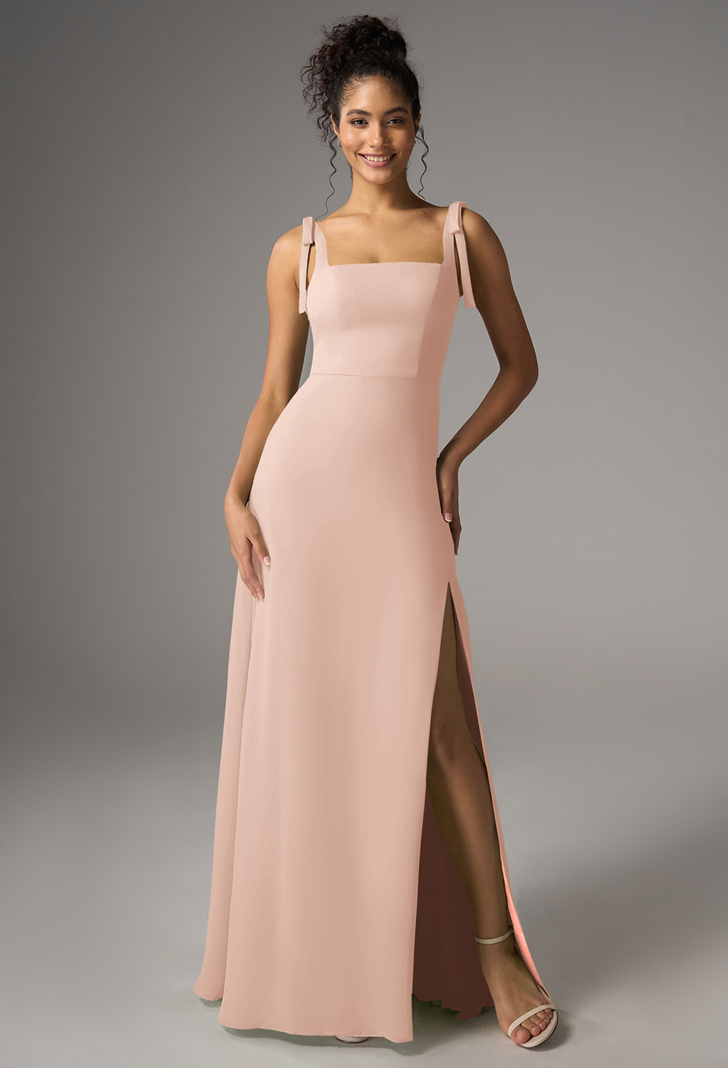 featuring a chiffon A-line silhouette with a floor-length hem and square neckline. The sleeveless