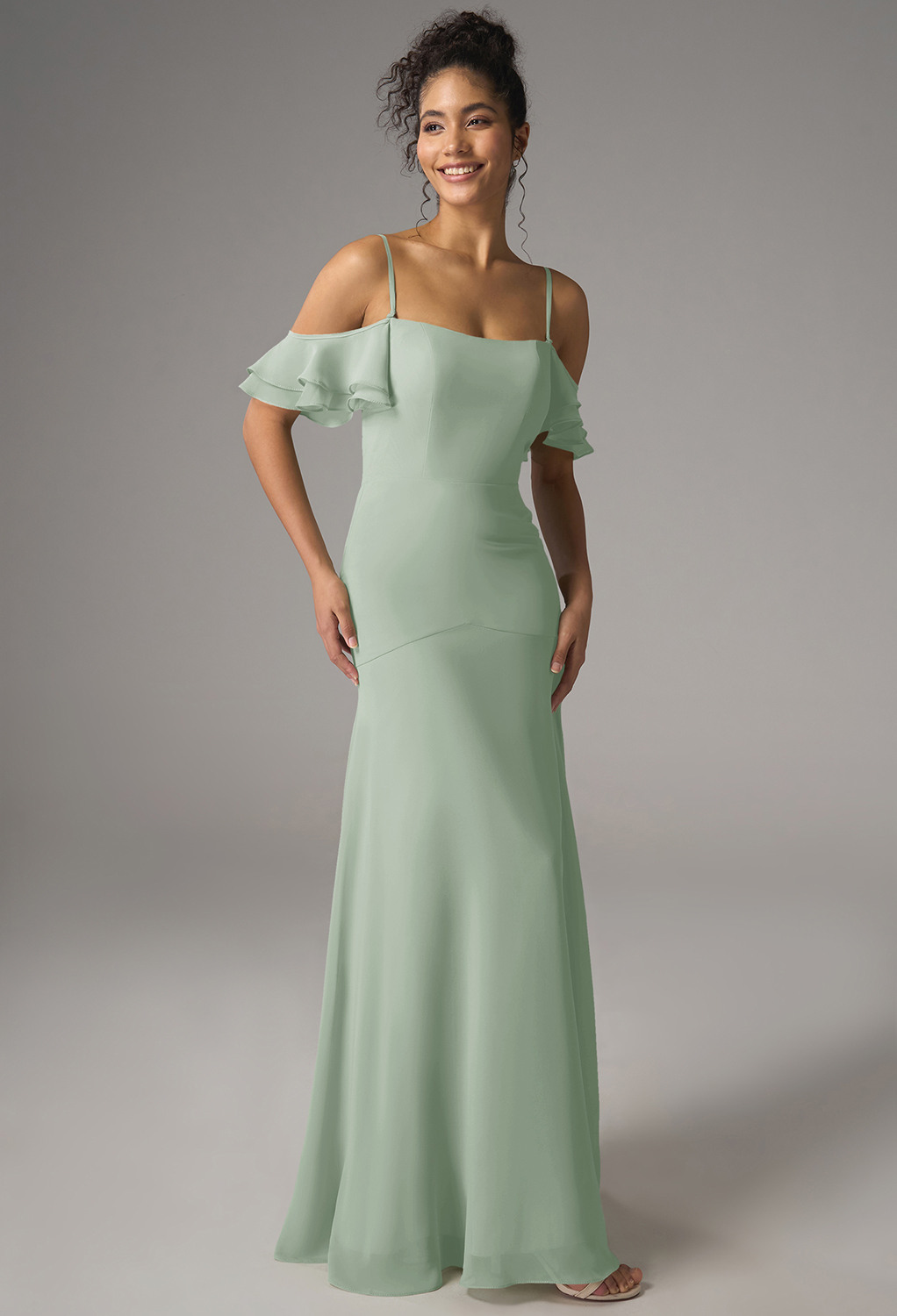 a chiffon A-line silhouette with a floor-length hem and square neckline. The off-the-shoulder design with spaghetti straps adds a touch of romance