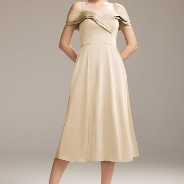 The off-shoulder dress is a princess-like bridesmaid dress made from shiny and sleek satin charmeuse. The A-line tea-length gown features an attention-grabbing sweetheart neckline and a little ruffle from the waist down. Fully lined and complete with a bu