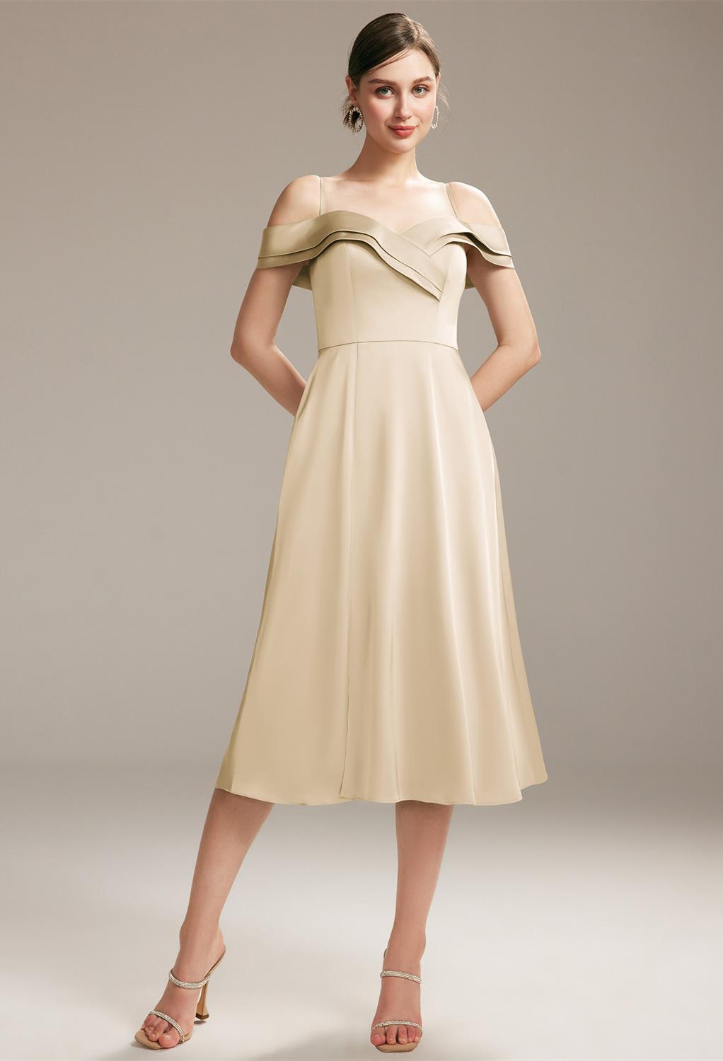 The off-shoulder dress is a princess-like bridesmaid dress made from shiny and sleek satin charmeuse. The A-line tea-length gown features an attention-grabbing sweetheart neckline and a little ruffle from the waist down. Fully lined and complete with a bu