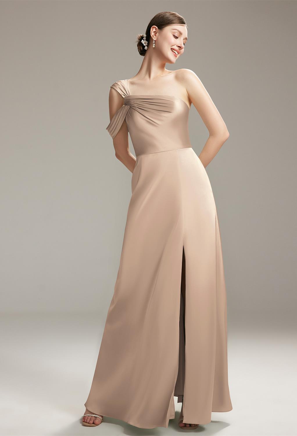 This bridesmaid dress is an alluring floor-length strapless gown perfect for any enchanting wedding celebration. Its satin mermaid silhouette with an asymmetrical neckline adds to its allure. The dress's stunning open back and built-in bra contrib