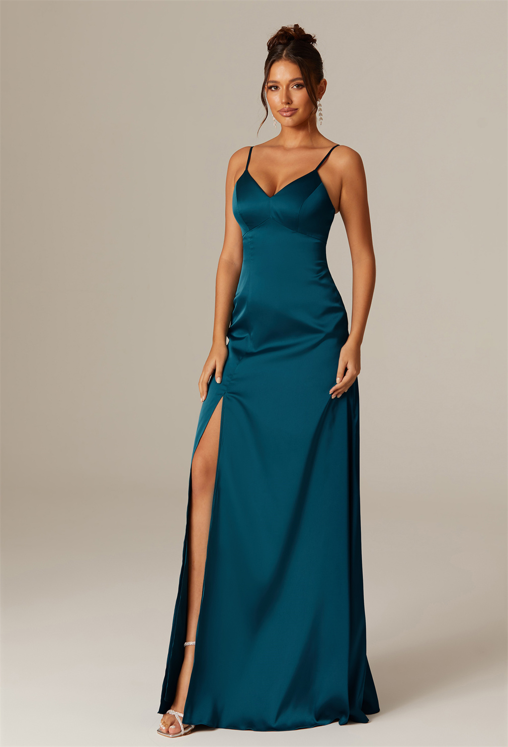 featuring a floor-length cut and an alluring V-neck for an elegant silhouette.