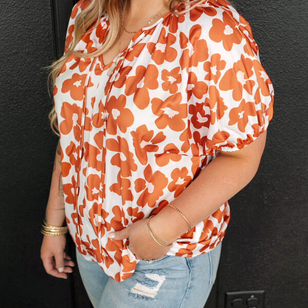 This stylish blouse has a flattering v neck that complements your look. The short sleeves give a comfortable and breezy feel