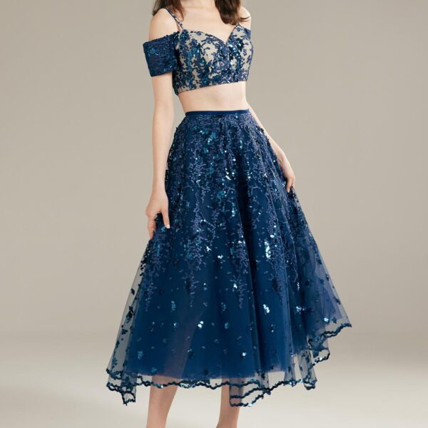 this dress exudes a regal and sophisticated aura that will captivate everyone in the room. The off-shoulder e