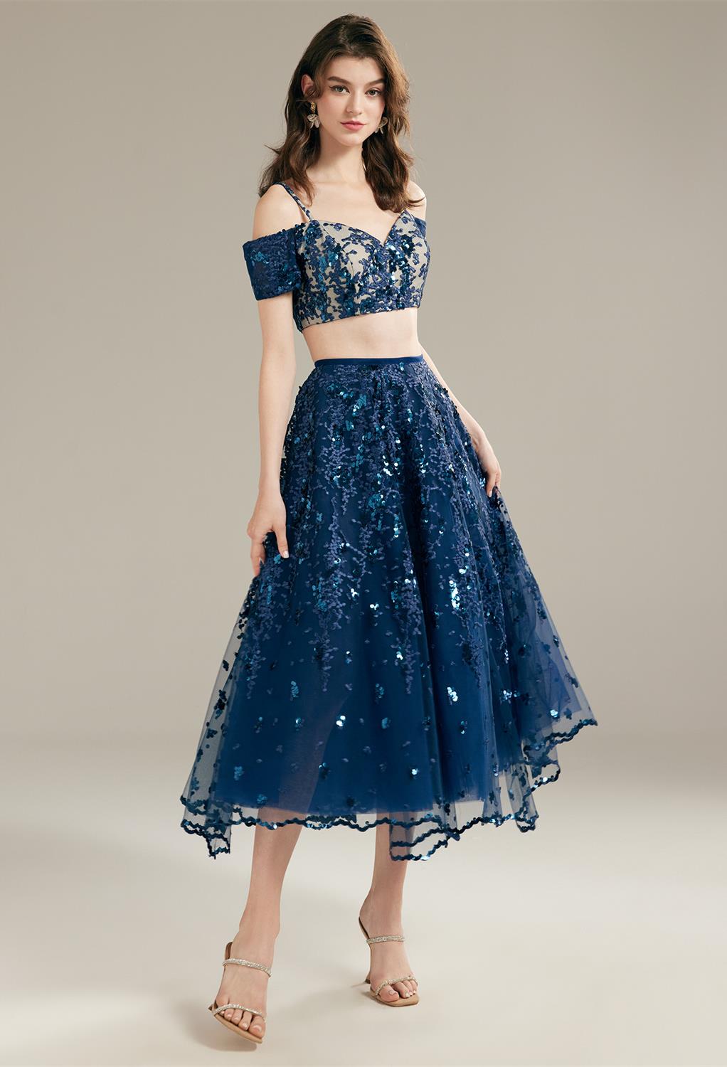 this dress exudes a regal and sophisticated aura that will captivate everyone in the room. The off-shoulder e