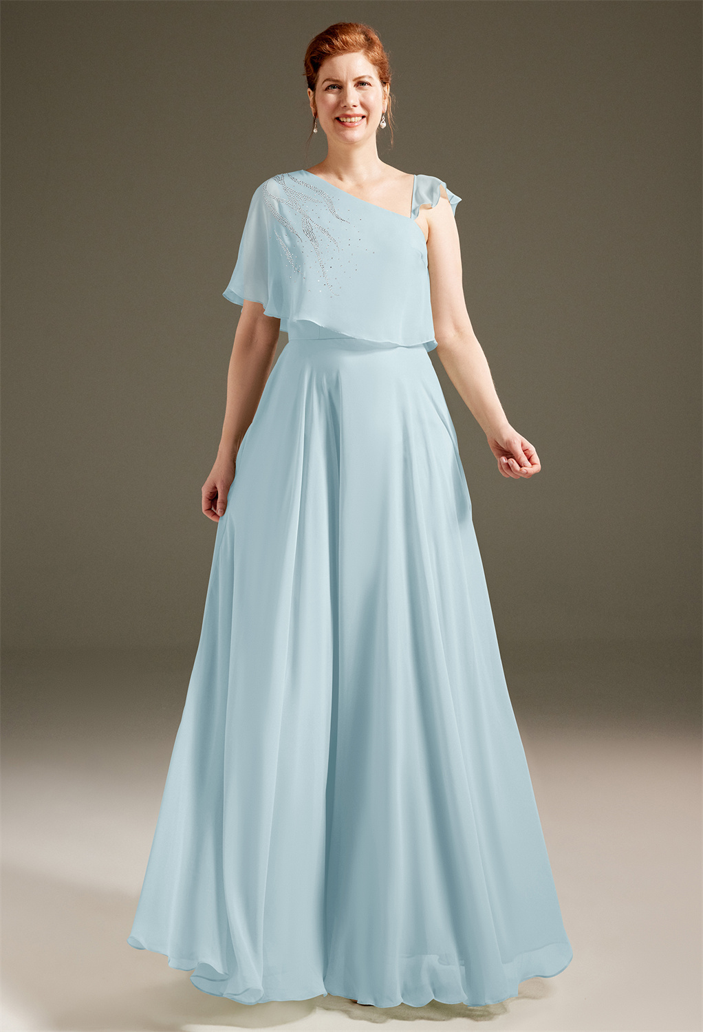 AW Nellie carries a natural light of heavenly endearing beauty that makes every mother feel fascinating and look golden. It is designed from exquisite chiffon and features a bodice with a harmonious blend of asymmetrical cape one-shoulder and a single str