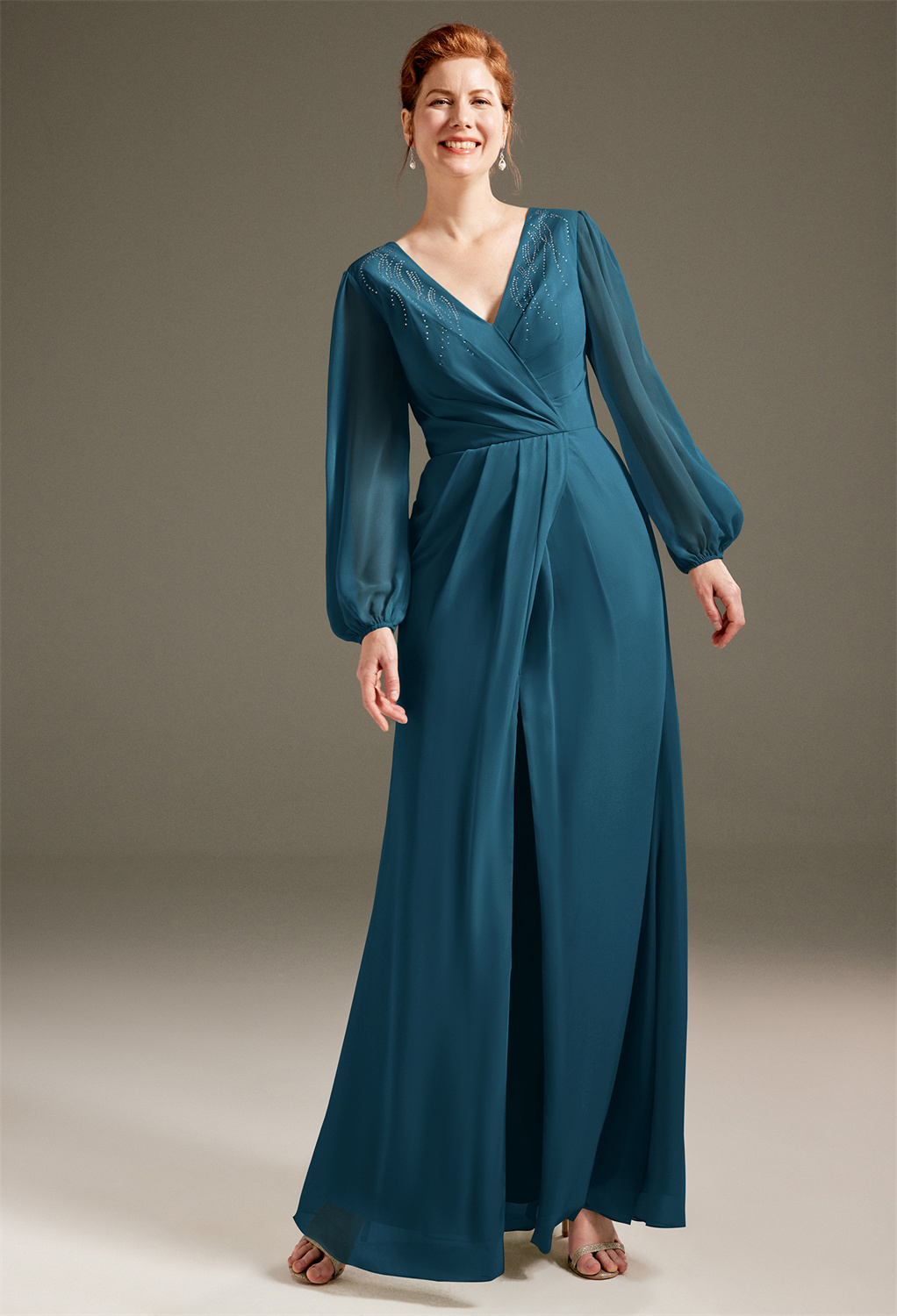 this dress is soft on the skin and guarantees a graceful glide. It's styled as an intricately designed v-neck dress with illusion puff sleeves.