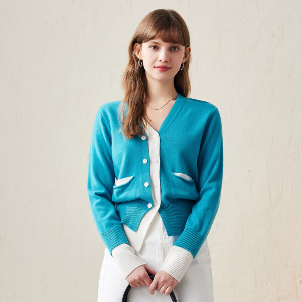 Refresh your wardrobe with our Chic Color-Block Button-Up Cardigan. This stylish cardigan combines comfort and modern design