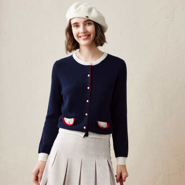 Step into timeless elegance with our Classic Contrast Trim Cardigan. Featuring sophisticated details and a refined design