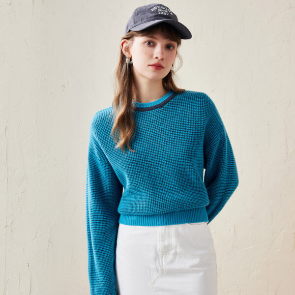 Elevate your casual wardrobe with our Colorblock Raglan Sleeve Sweater. This stylish and cozy sweater features a unique colorblock design with contrasting sleeves that add a playful yet sophisticated touch to your look. Crafted from a soft and comfortable