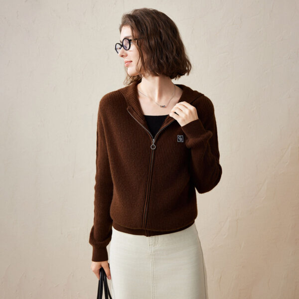 This ribbed knit hoodie combines style and functionality in a way that makes it a must-have for any casual wardrobe. The soft