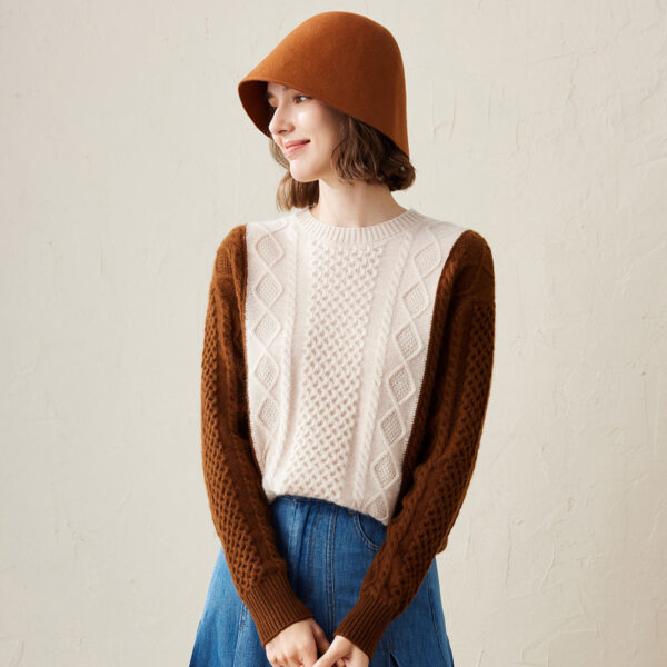 Elevate your winter wardrobe with our Women's Cozy Colorblock Cable Knit Sweater. This versatile sweater combines classic cable knit patterns with modern colorblocking