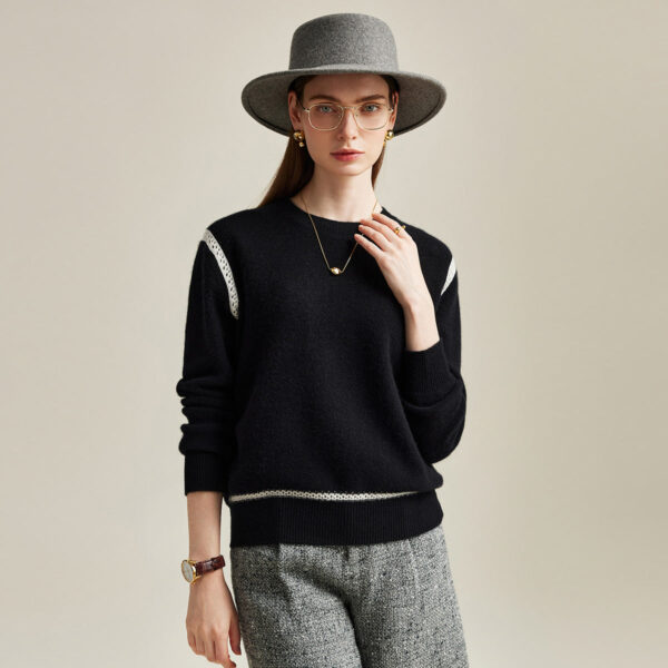 Add a touch of elegance to your wardrobe with this Knit Sweater with Lace Accent. This refined piece features subtle lace detailing on the shoulders and hem