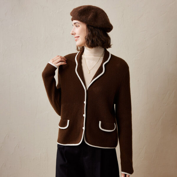 Wrap yourself in timeless elegance with our Classic Contrast Trim Knitted Cardigan. Designed for those who appreciate the finer details