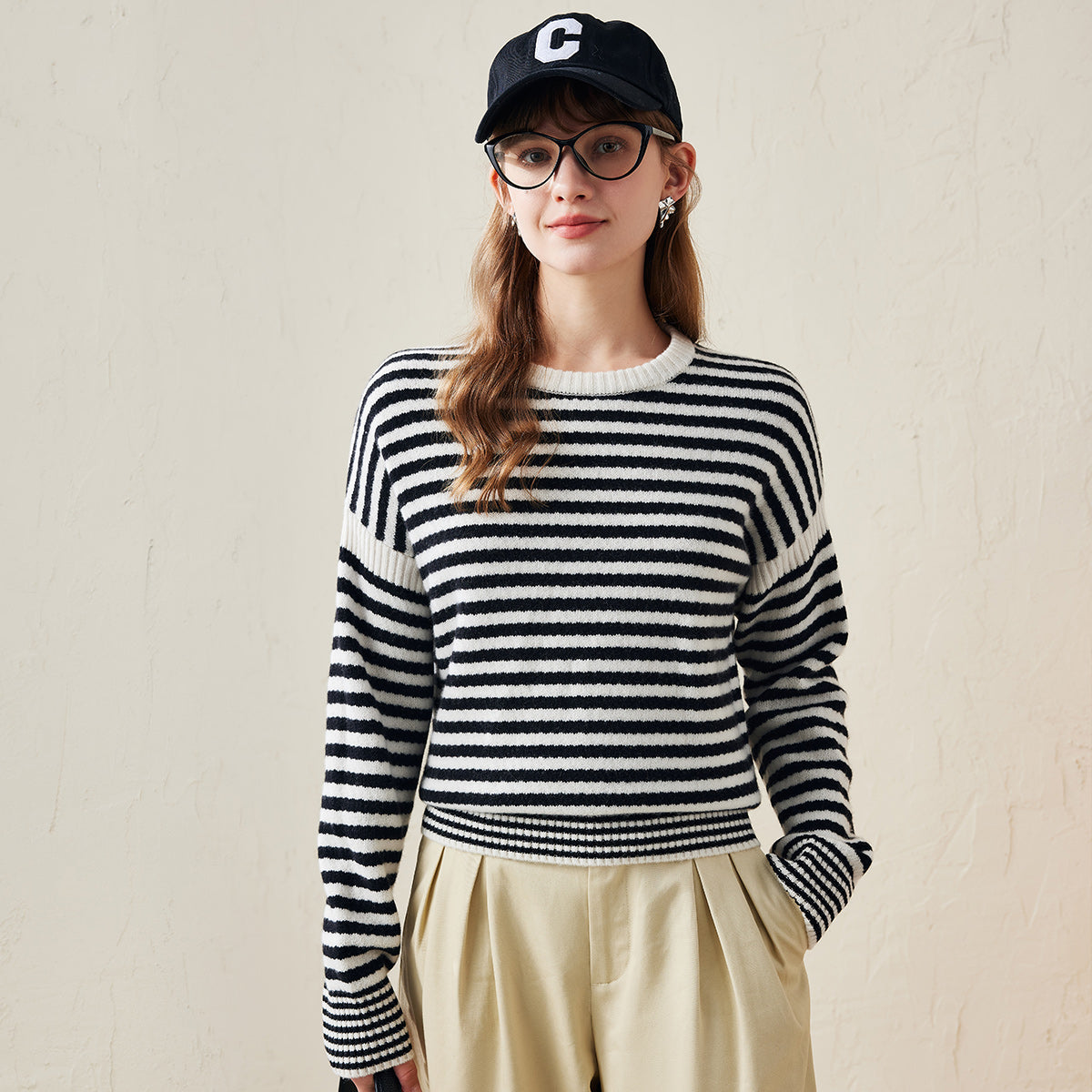 Stay stylish and comfortable with our Striped Knitted Pullover Sweater. This versatile sweater is designed with classic stripes