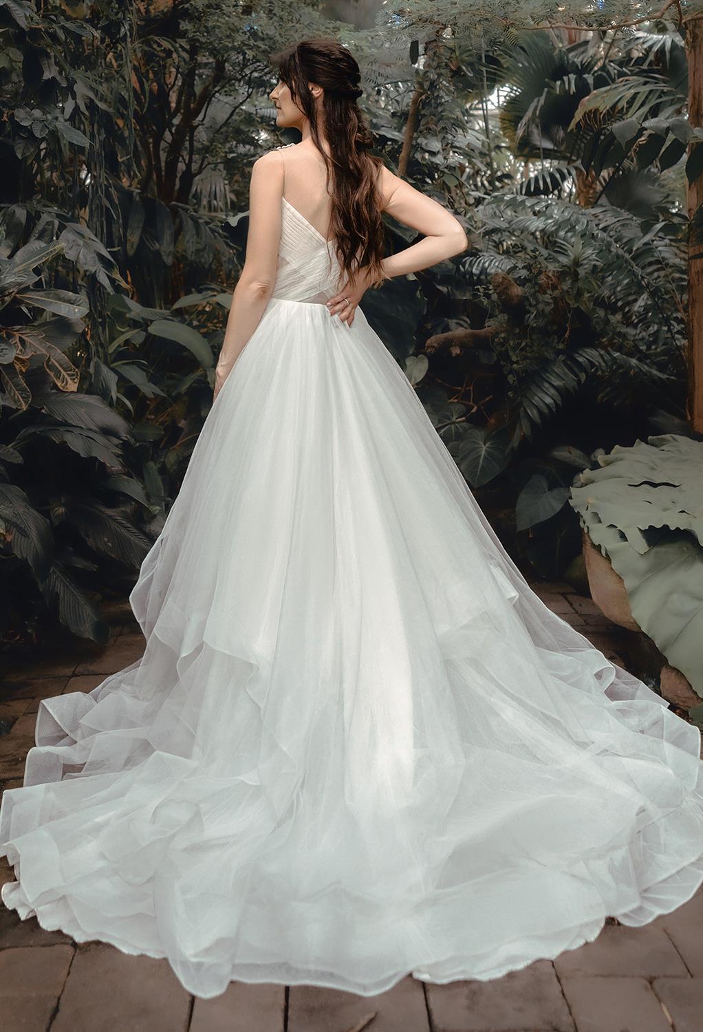 barely there straps and lots of lovely layers that add incredible romantic dimension to your look. The wedding dress is offered in a crisp bridal white or an elegant ivory that lends an old world charm