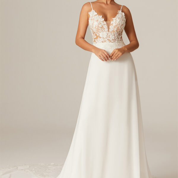 the tulle V-neckline wedding dress illuminates your beauty. The  A-line style and chapel train create a mesmerizing aura of timeless charm.