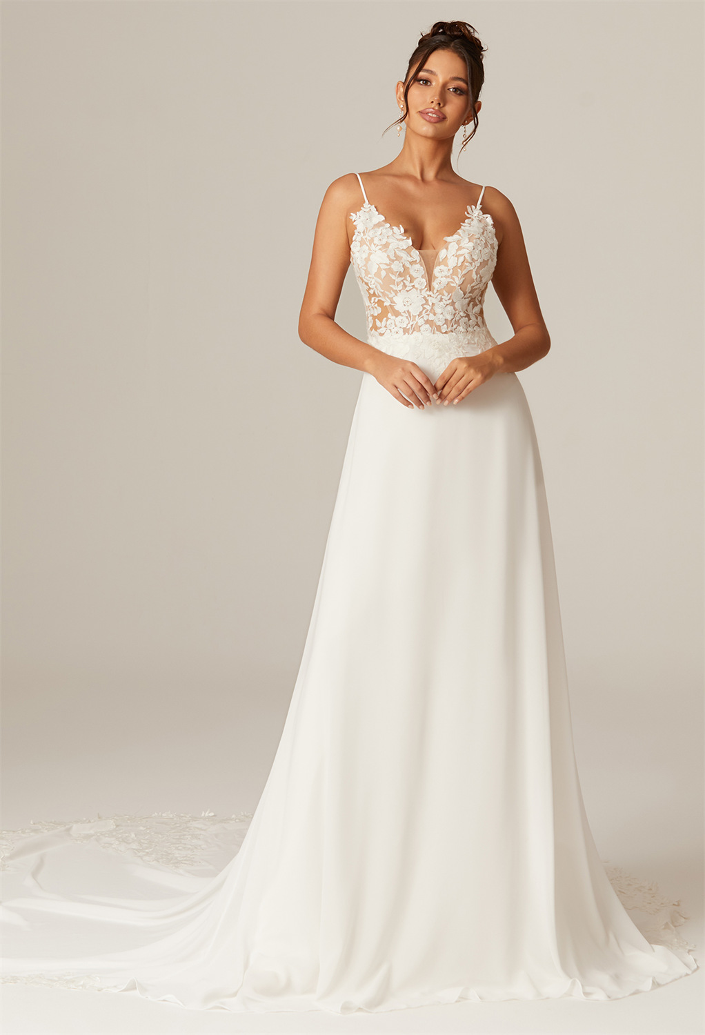 the tulle V-neckline wedding dress illuminates your beauty. The  A-line style and chapel train create a mesmerizing aura of timeless charm.
