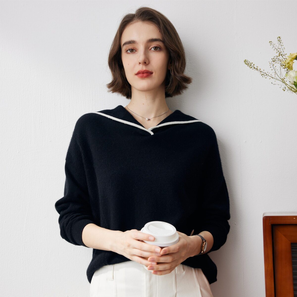 this sweater combines luxurious comfort with sophisticated style. The classic midnight black color is complemented by a