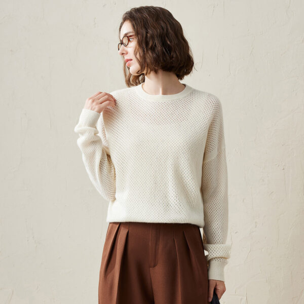 Add a splash of color to your wardrobe with our breathable lightweight mesh sweater. Made with a comfortable