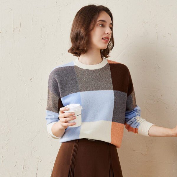 Elevate your fall and winter wardrobe with this beautifully crafted color block plaid sweater