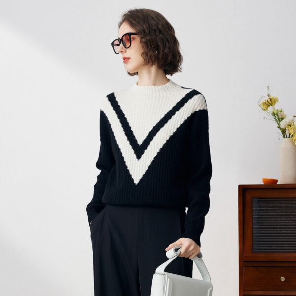 Fabric:100% Cashmere Contrasting Details: This sweater features a striking large V-pattern in contrasting colors