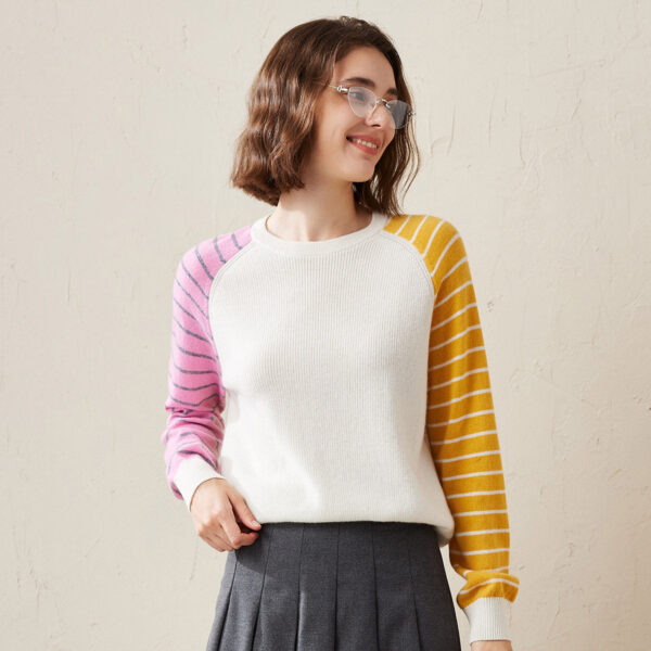 Bring a pop of color to your wardrobe with this unique Color Block Striped Sleeve Sweater. Featuring contrasting stripes on each sleeve
