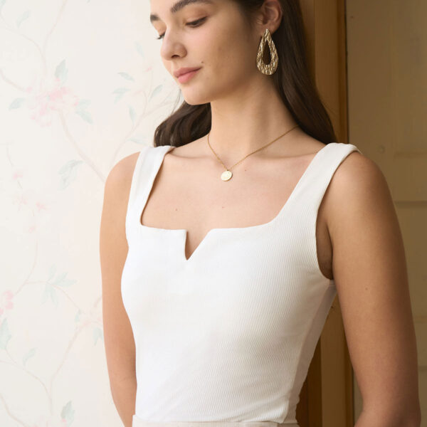 Fabric:This Knit Top is made of Viscose and Spandex. Viscose (aka rayon) is a man-made cellulosic fiber made from wood pulp. It's soft