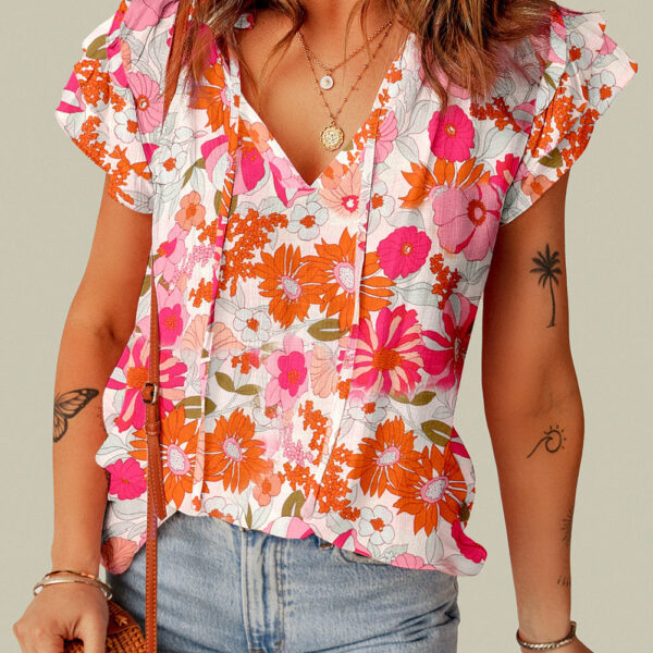 Elevate your closet with this beautiful Floral Blouse featuring a Split V Neck and Ruffle Sleeves. The charming ruffles add a dash of femininity