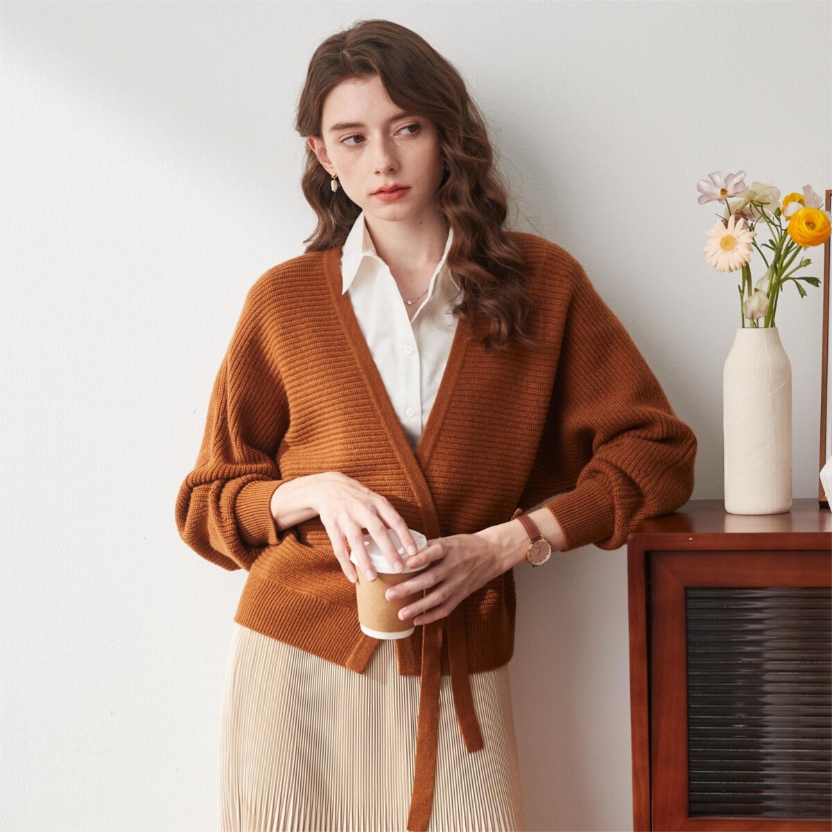 Fabric：100% Wool Fashionable V-Neck: This cardigan features a stylish V-neck design that beautifully enhances the neckline. The V-neck not only adds a touch of elegance but also provides a flattering fit that complements various body types