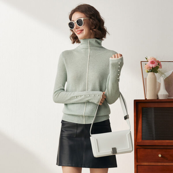 Upgrade your wardrobe with this sophisticated and stylish turtleneck sweater. Designed with meticulous attention to detail