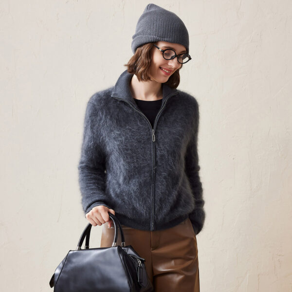 Indulge in the ultimate cozy experience with our Women's Soft and Fluffy Zipper Cardigan. This cardigan is designed to provide maximum comfort and warmth while keeping you stylish throughout the cooler seasons. The soft
