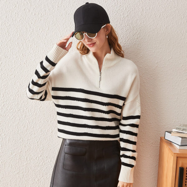 Elevate your casual wardrobe with our Chic Striped Half-Zip Knit Sweater. This stylish sweater combines classic black and white stripes with a modern half-zip design