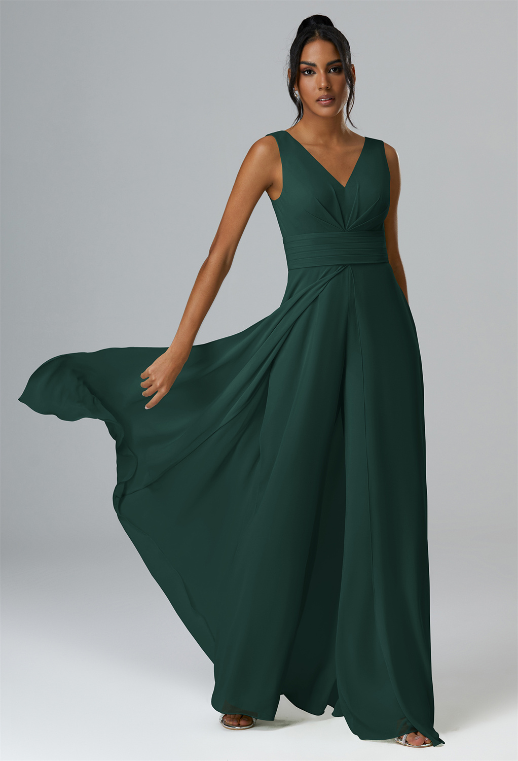 Rock a modern casual-cool vibe in this chiffon jumpsuit designed with an alluring V-neck and leg-elongating floor-length hemline.
