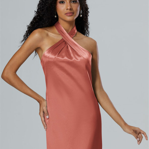 where the v-neck pairs daringly with a sleeveless and strapless design. The crystal satin fabric shimmers with every step