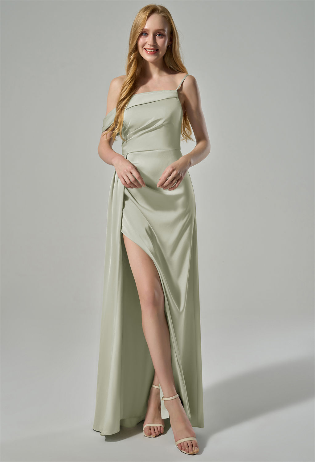 while the high slit on the skirt adds a touch of allure. The back of the dress showcases a simple yet sophistic