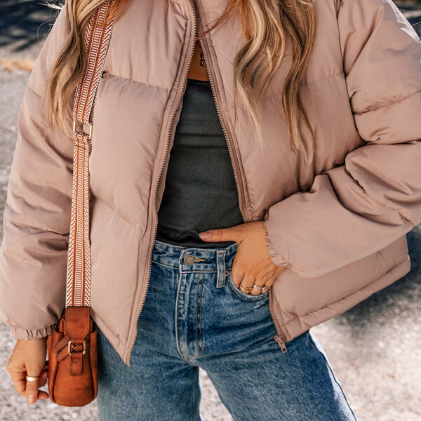  Keep warm and stay cool in this puffy jacket with a full zipper. Its quilted pattern adds some texture and class. The high collar keeps you cozy and fashionable. The shift style offers a flattering and comfy fit.