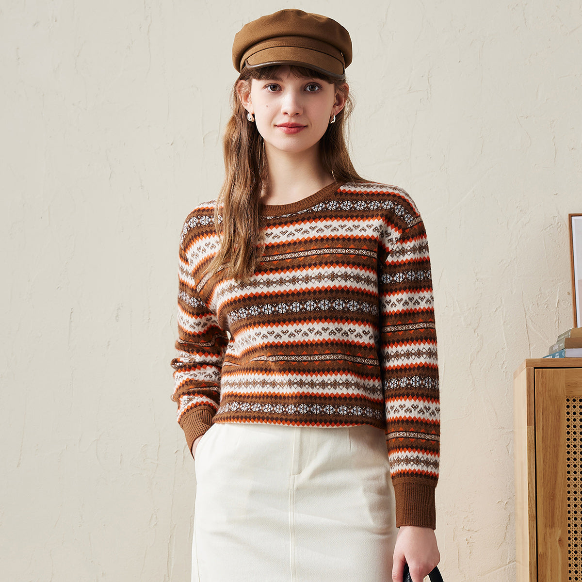 Embrace the cozy charm of winter with our Women's Fair Isle Sweater. This timeless piece brings together tradition and modern style with its intricate Fair Isle pattern