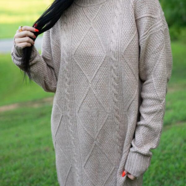 Playfully detailed cable knit creates a cozy yet stylish aura. Effortlessly chic drop shoulder design adds a touch of casual elegance. Embrace comfort with a flattering loose fit for all body shapes. Versatile enough to dress up or down for any occasion.