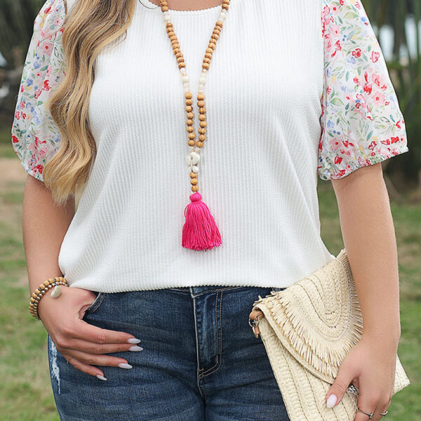 This plus blouse exudes elegance with a chic puff sleeve design. The contrast floral print adds a touch of sweet femininity to this top. The textured and stretchy ribbed knit fabric ensures a comfortable wear. Plus size dresses are also in high demand for