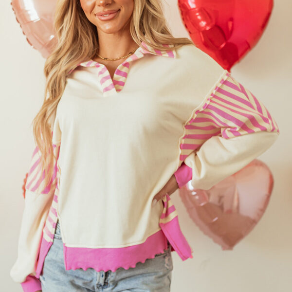  This pullover has a striped patch that adds a touch of chic and a unique color block design. The collared neckline adds a polished and professional touch. Made with soft and warm French terry knit