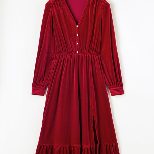 Lavishly soft velvet cloth for a classy appearance. Fancy V-neck with button embellishments. Chic balloon sleeves for a fashionable flair. Dainty frilled hem and alluring split for a girly finish.