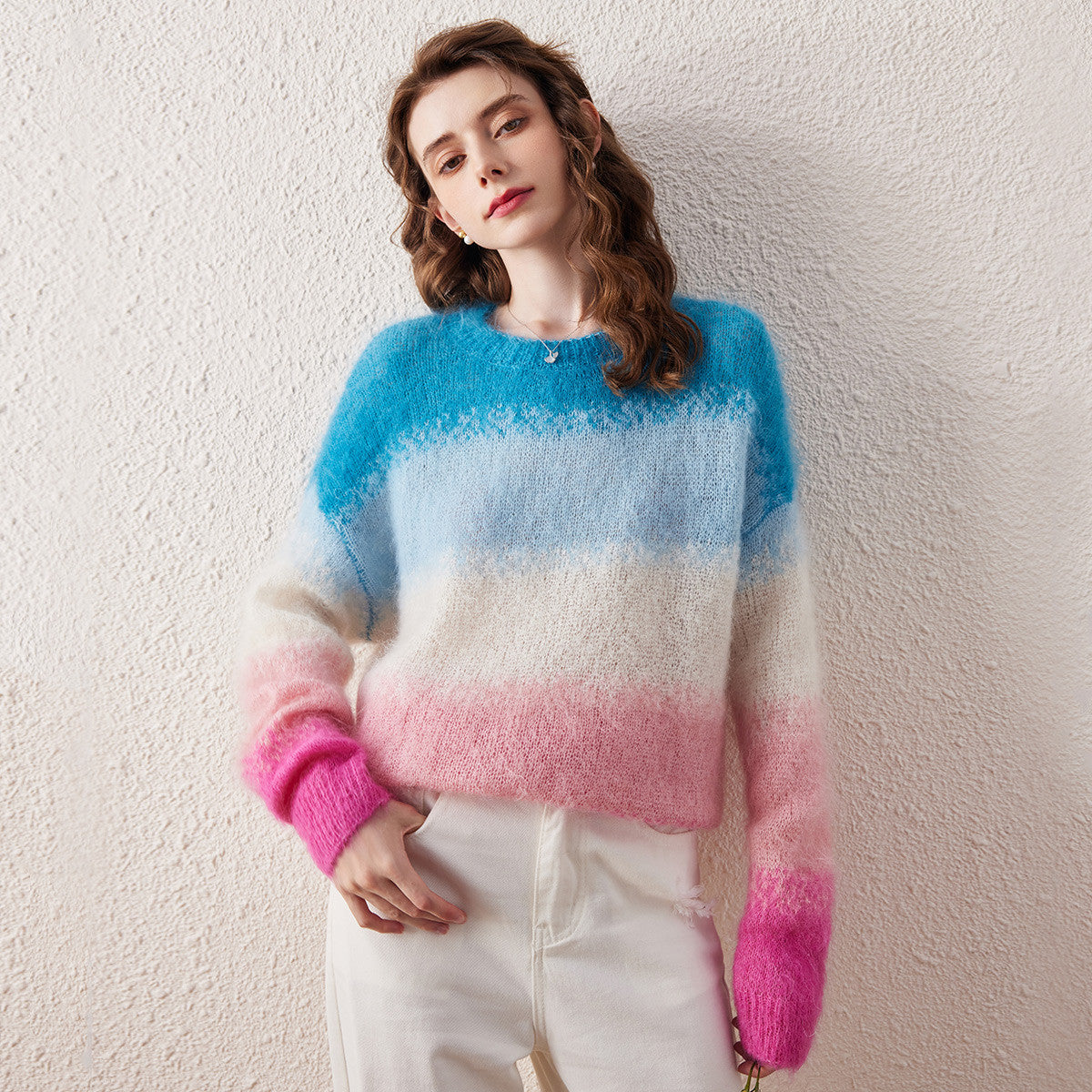 Add a burst of color to your wardrobe with our Mohair Gradient Color Block Fluffy Knit Sweater. This cozy sweater features a beautiful gradient design that transitions from vibrant blue to soft pink